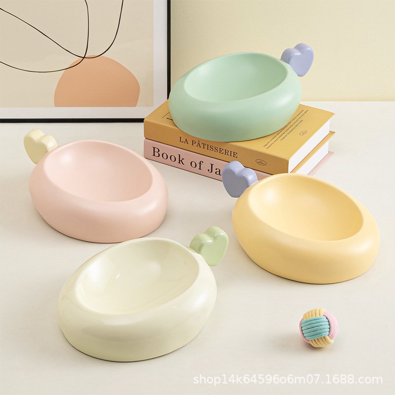 Cream ceramic pet bowl with a wide base